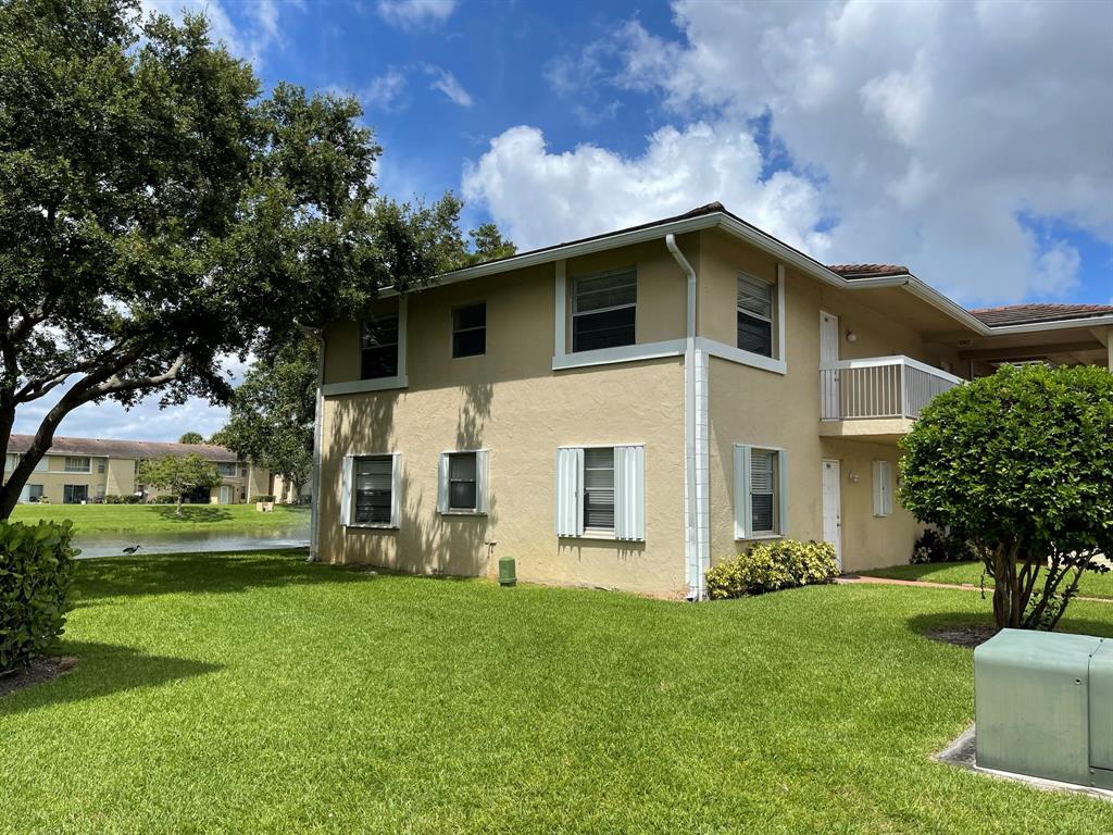 9971 Twin Lakes Drive, Unit 9G Coral Springs, FL 33071 - Photo 12 of 13 a house view with a garden space