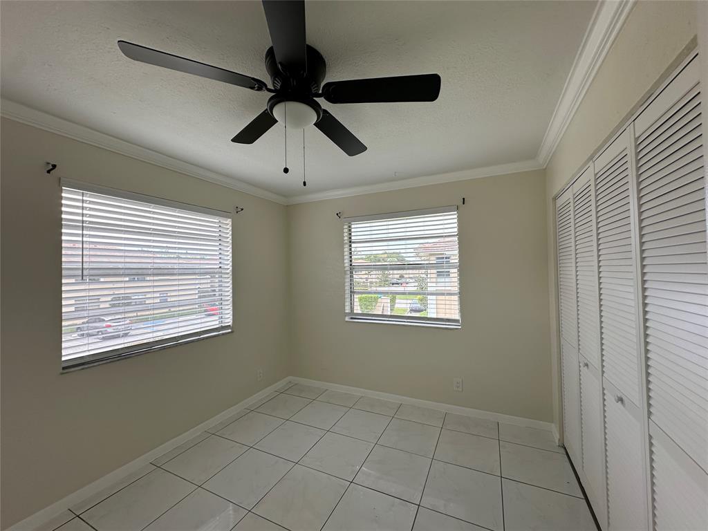 9971 Twin Lakes Drive, Unit 9G Coral Springs, FL 33071 - Photo 6 of 13 a view of an empty room with a window