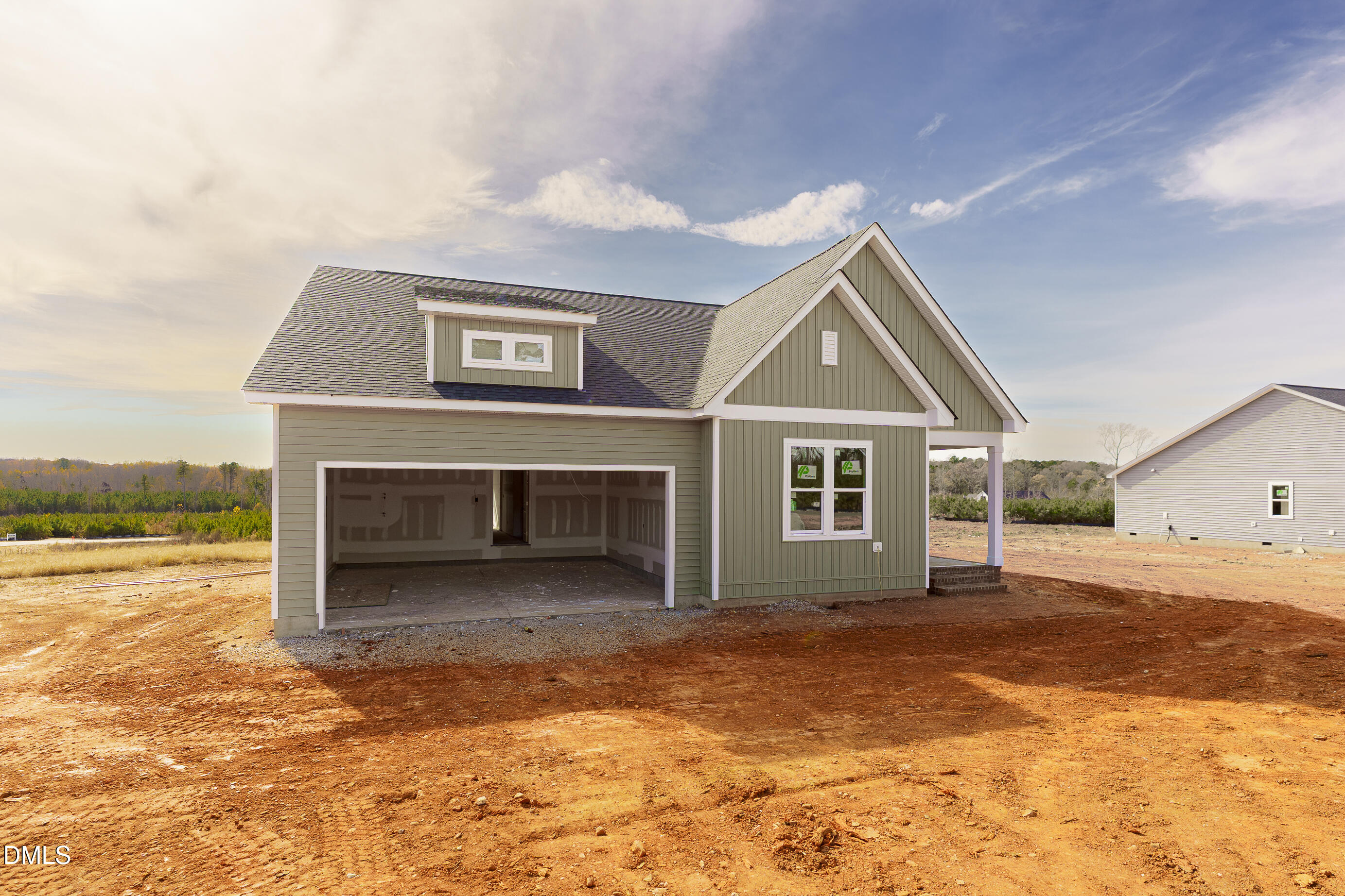 2784 River Meadow Spring Hope, NC 27882 - Photo 9 of 19 a view of a house with a yard and garage