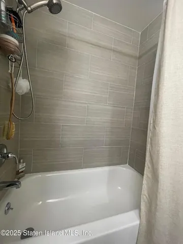 front view of a house with swimming pool and a yard