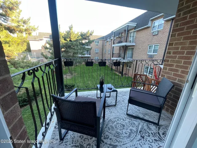 a view of a swimming pool with a yard