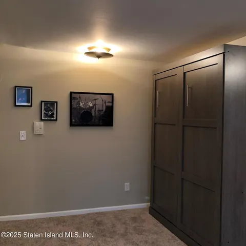 a bathroom with a toilet a sink and a mirror