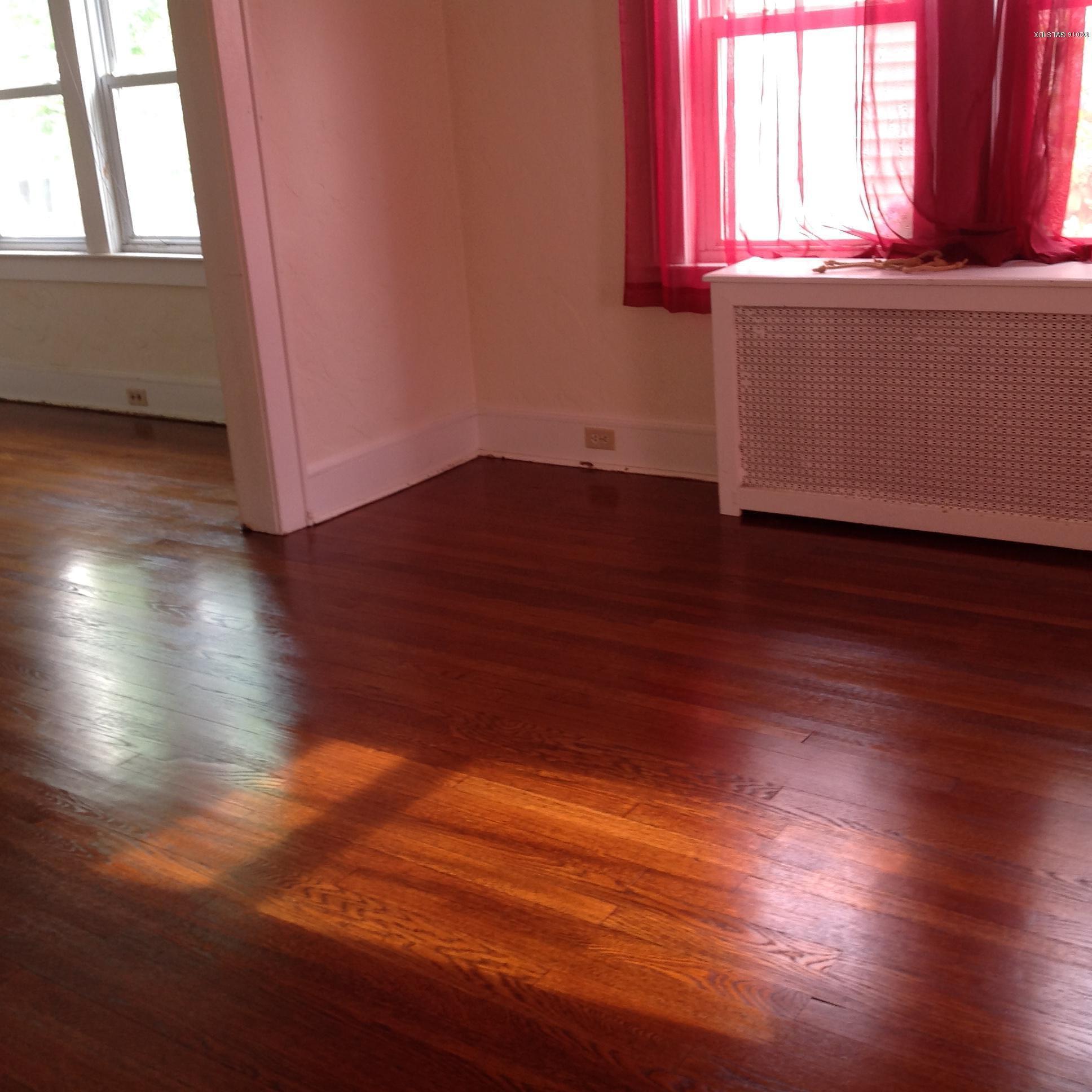 40 Sheep Hill Road Riverside, CT 06878 - Photo 2 of 11 an empty room with wooden floors and windows