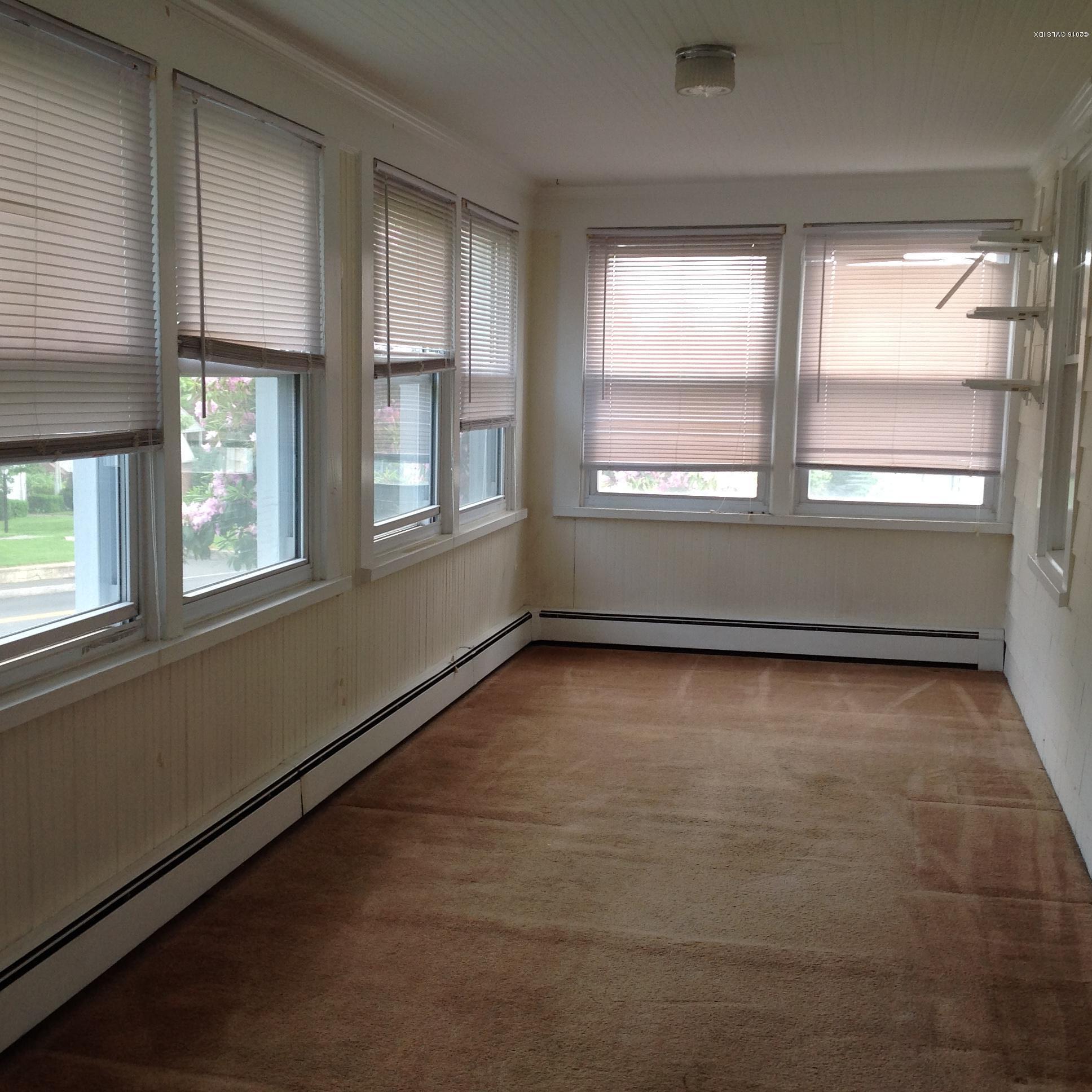 40 Sheep Hill Road Riverside, CT 06878 - Photo 5 of 11 an empty room with wooden floor and windows