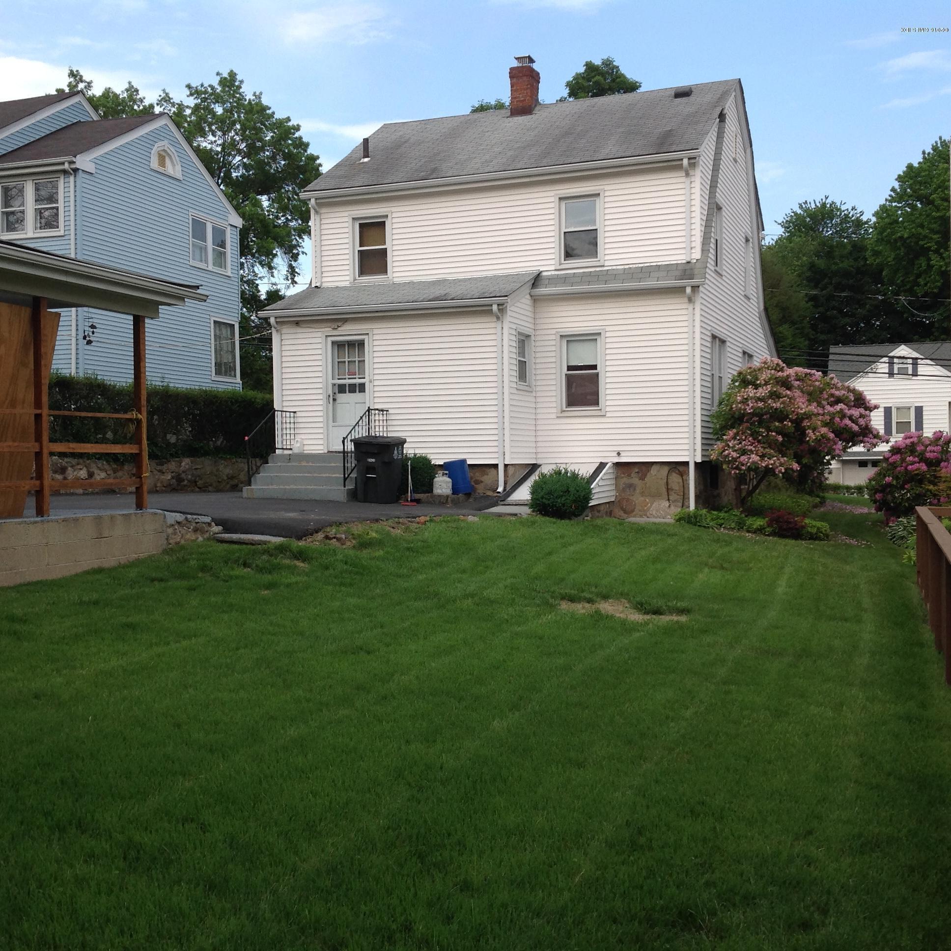 40 Sheep Hill Road Riverside, CT 06878 - Photo 10 of 11 a front view of house with yard and green space