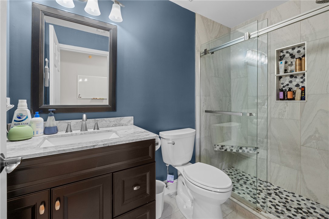 433 Harts Cove Way Seneca, SC 29678 - Photo 8 of 24 Bath 2 - Tile shower to ceiling - updated shower door, all new cabinetry, vanities