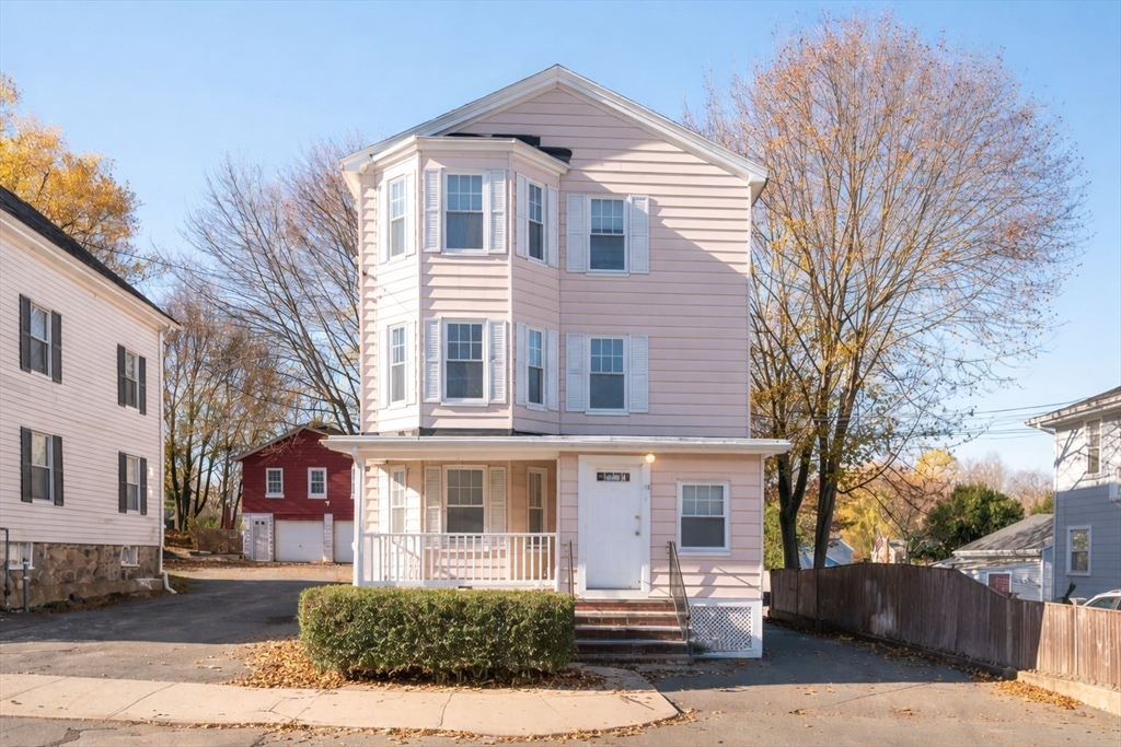 13 Giles Avenue, Unit 2 Beverly, MA 01915 - Photo 1 of 27 a front view of a house with a yard