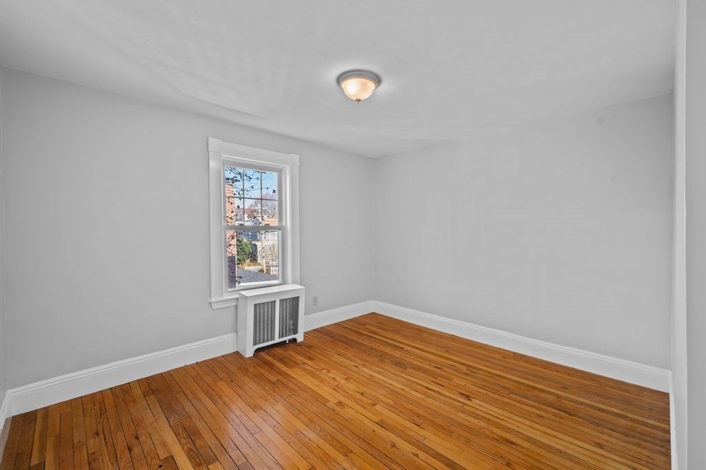 13 Giles Avenue, Unit 2 Beverly, MA 01915 - Photo 13 of 27 a view of empty room with wooden floor and fan