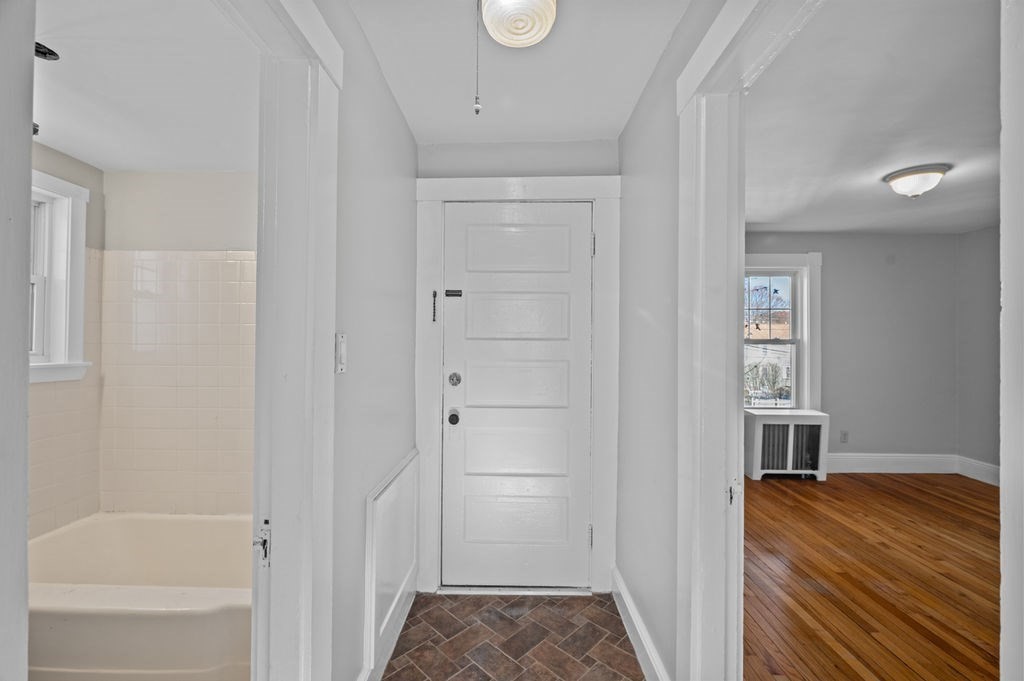 13 Giles Avenue, Unit 2 Beverly, MA 01915 - Photo 17 of 27 a room that has a bed and a window in it