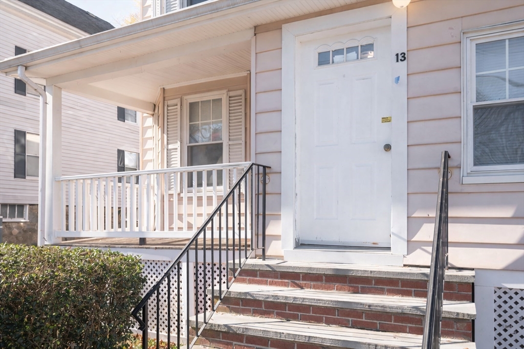 13 Giles Avenue, Unit 2 Beverly, MA 01915 - Photo 2 of 27 a view of staircase with white walls and windows