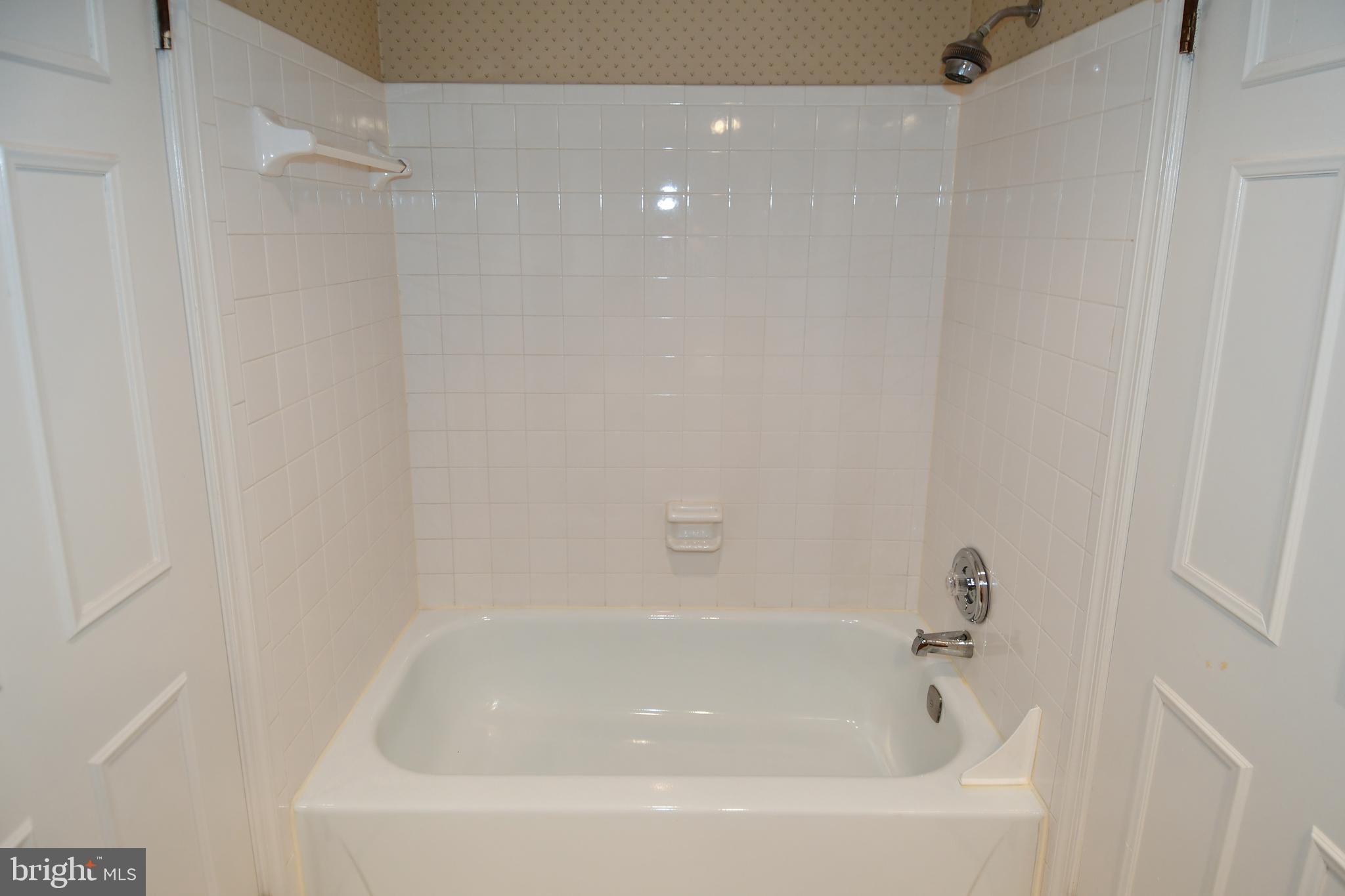 6730 Anders Terrace Springfield, VA 22151 - Photo 17 of 38 Neutral Tile tub surround