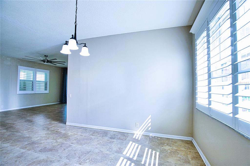 4398 Summertree Road Venice, FL 34293 - Photo 12 of 38 a view of an empty room with a window