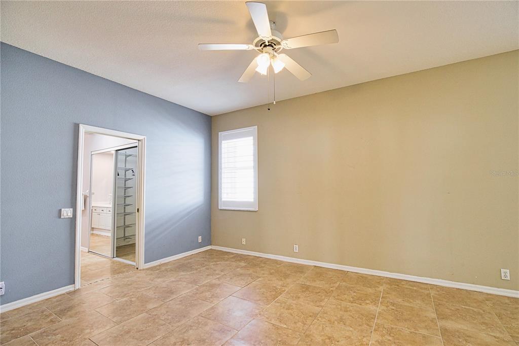 4398 Summertree Road Venice, FL 34293 - Photo 16 of 38 an empty room with windows and fan