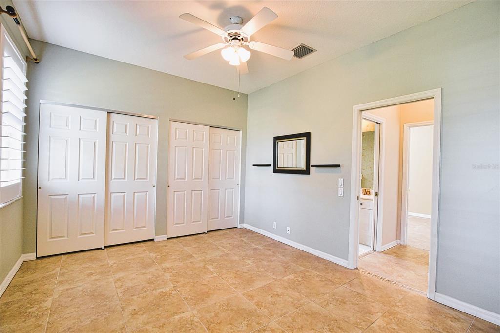 4398 Summertree Road Venice, FL 34293 - Photo 20 of 38 a view of an empty room with a window