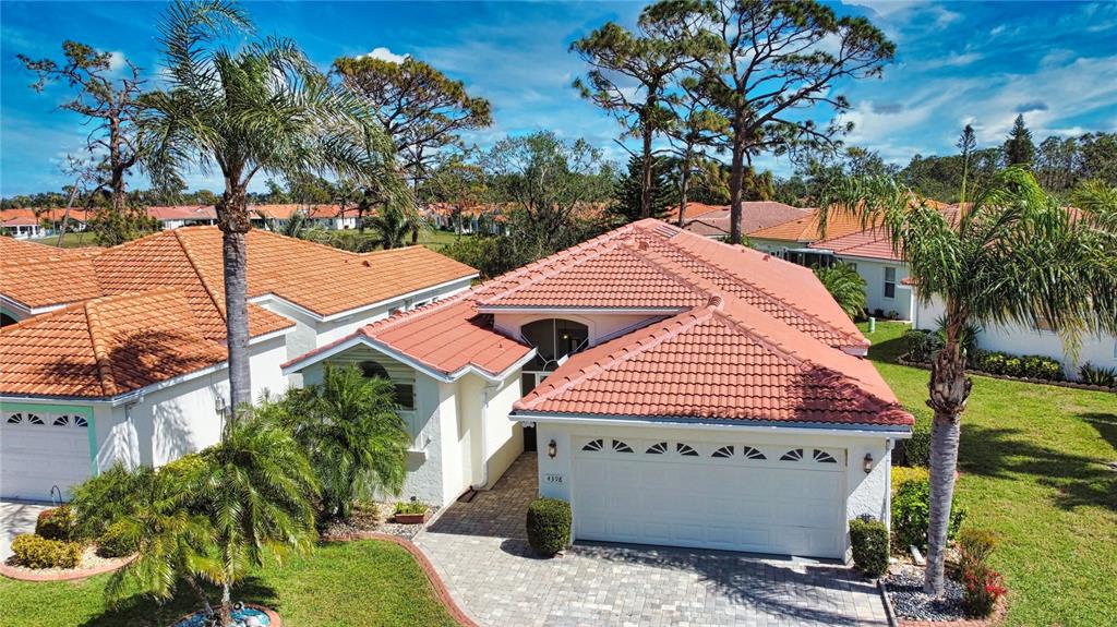 4398 Summertree Road Venice, FL 34293 - Photo 2 of 38 a aerial view of a house with a yard