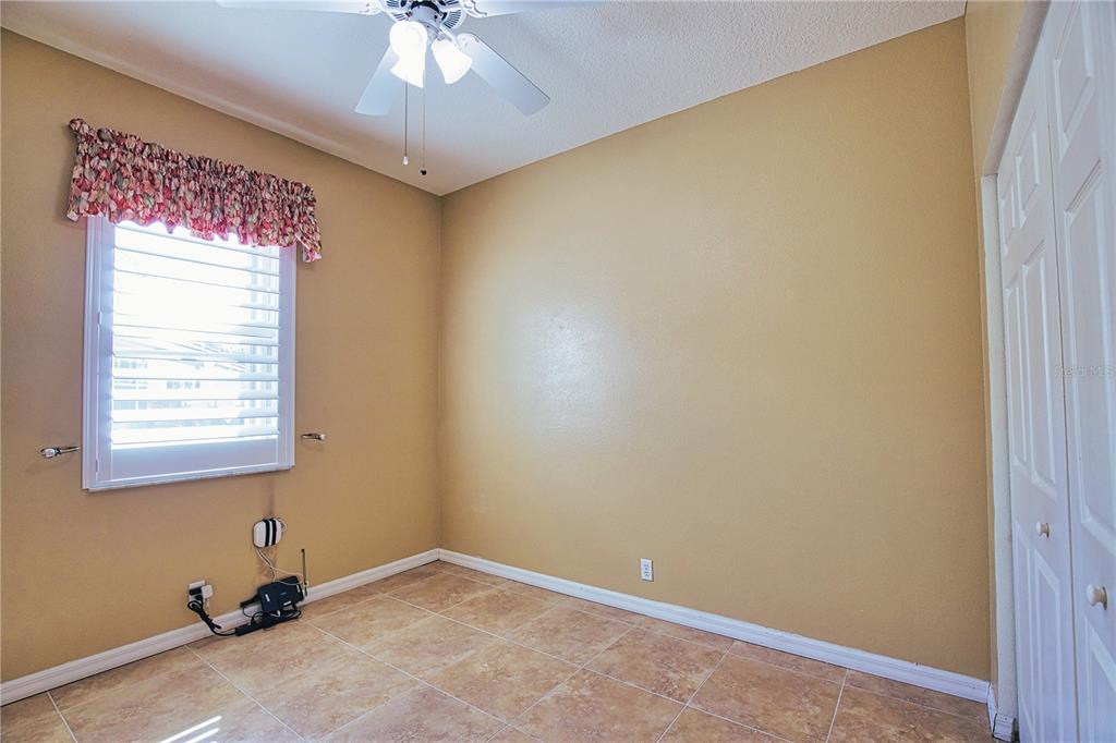 4398 Summertree Road Venice, FL 34293 - Photo 24 of 38 a view of room with window and ceiling fan