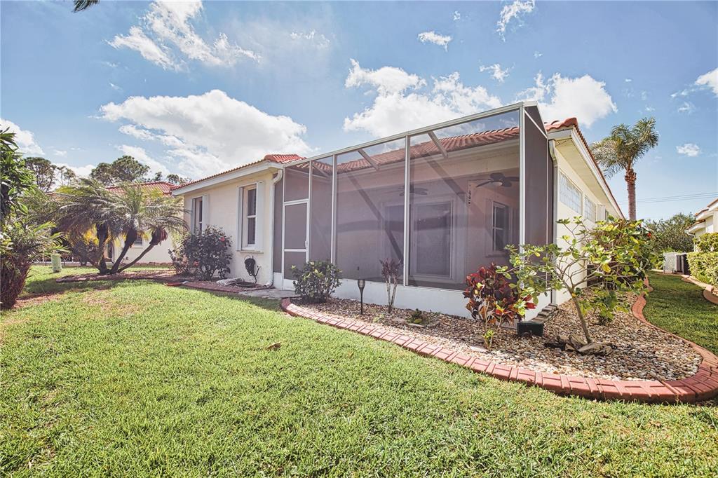 4398 Summertree Road Venice, FL 34293 - Photo 32 of 38 a garden view with a seating space