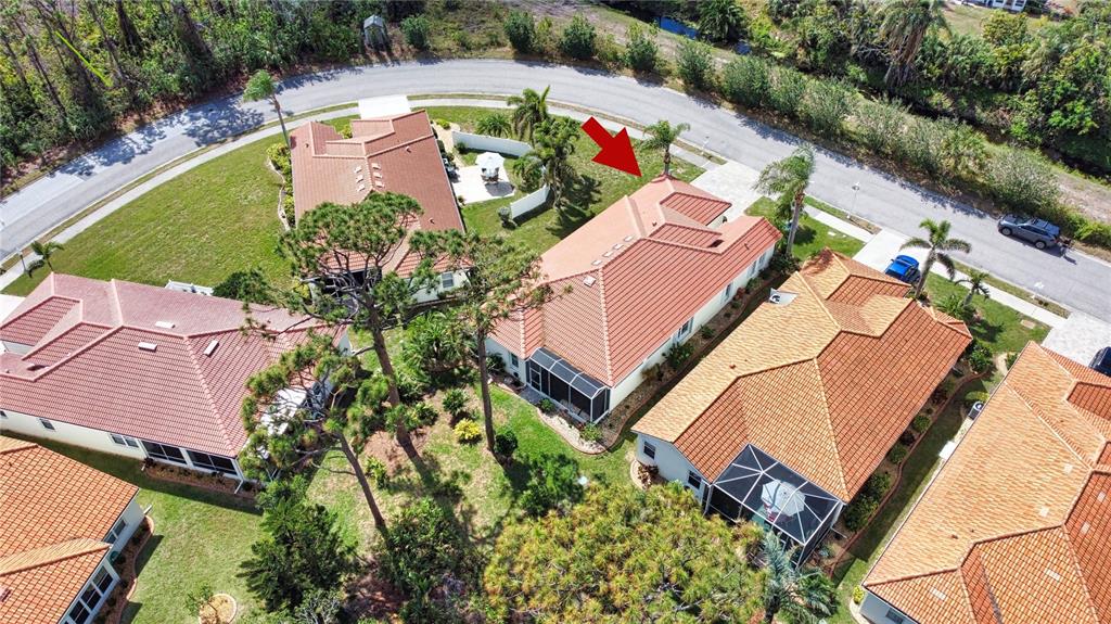 4398 Summertree Road Venice, FL 34293 - Photo 33 of 38 an aerial view of a house with a swimming pool