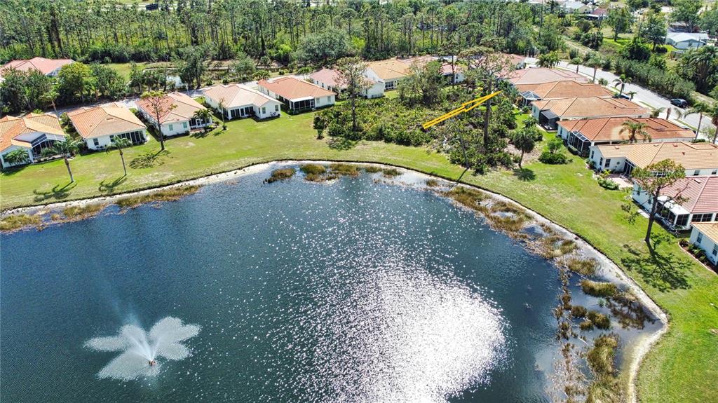4398 Summertree Road Venice, FL 34293 - Photo 38 of 38 a view of a lake with a yard