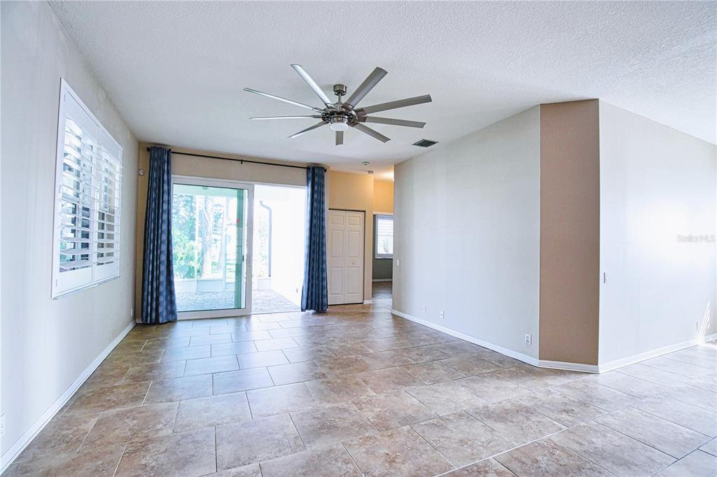 4398 Summertree Road Venice, FL 34293 - Photo 4 of 38 a view of an empty room with a window