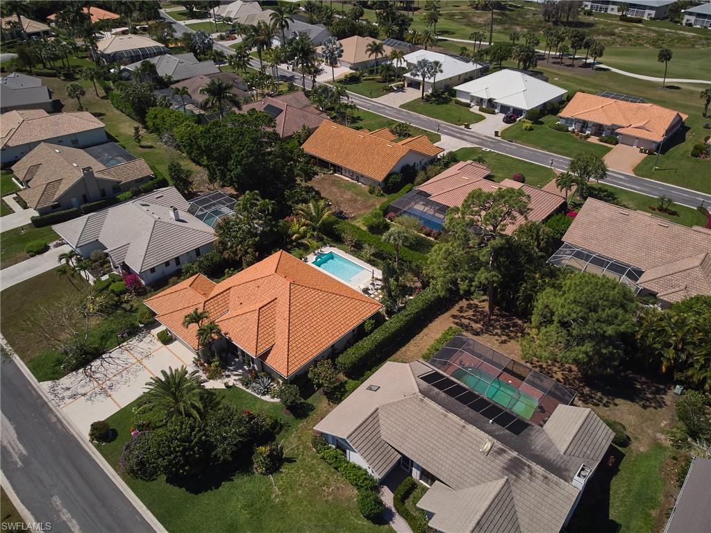 186 Muirfield Circle Naples, FL 34113 - Photo 35 of 36 an aerial view of residential houses with outdoor space
