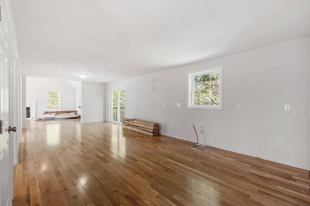 22 Benoit Avenue Pelham, NH 03076 - Photo 15 of 42 a view of empty room with wooden floor and windows