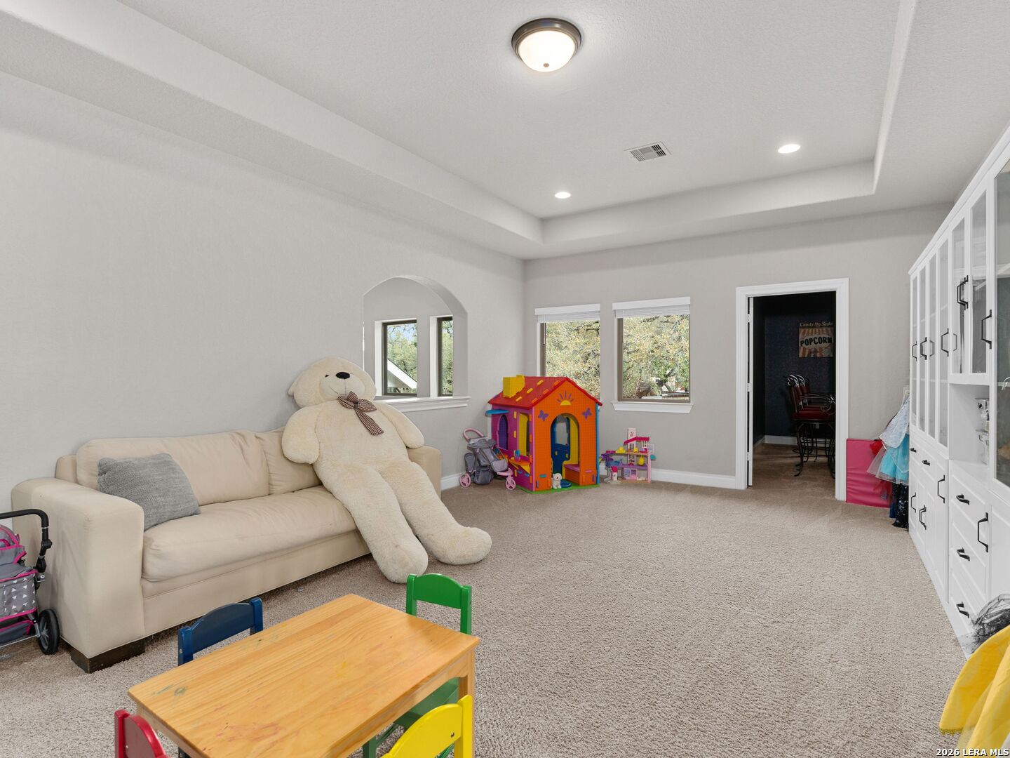 10281 Headwind Boerne, TX 78006 - Photo 20 of 45 a living room with furniture and a flat screen tv