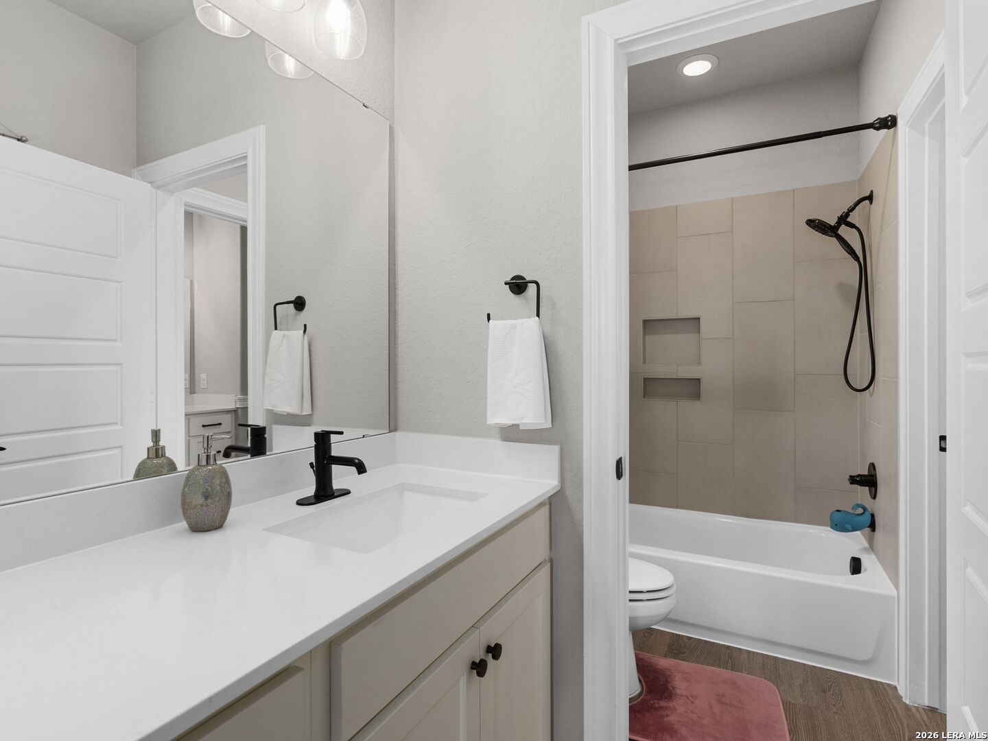 10281 Headwind Boerne, TX 78006 - Photo 29 of 45 a bathroom with a tub sink vanity mirror and toilet