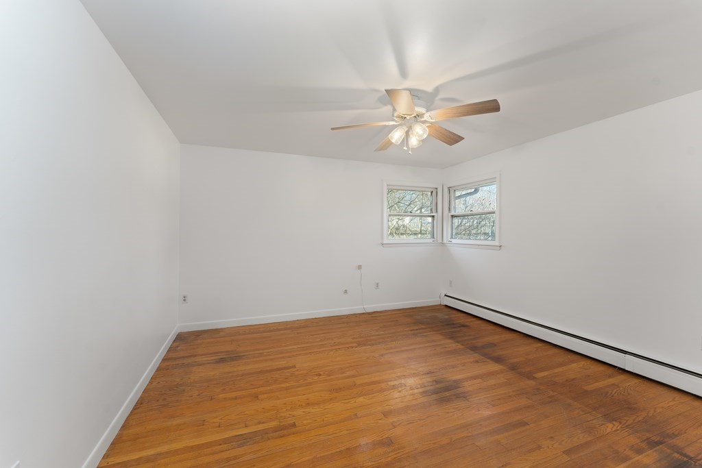110 Fieldwood Avenue Seekonk, MA 02771 - Photo 20 of 33 an empty room with a window and a fan