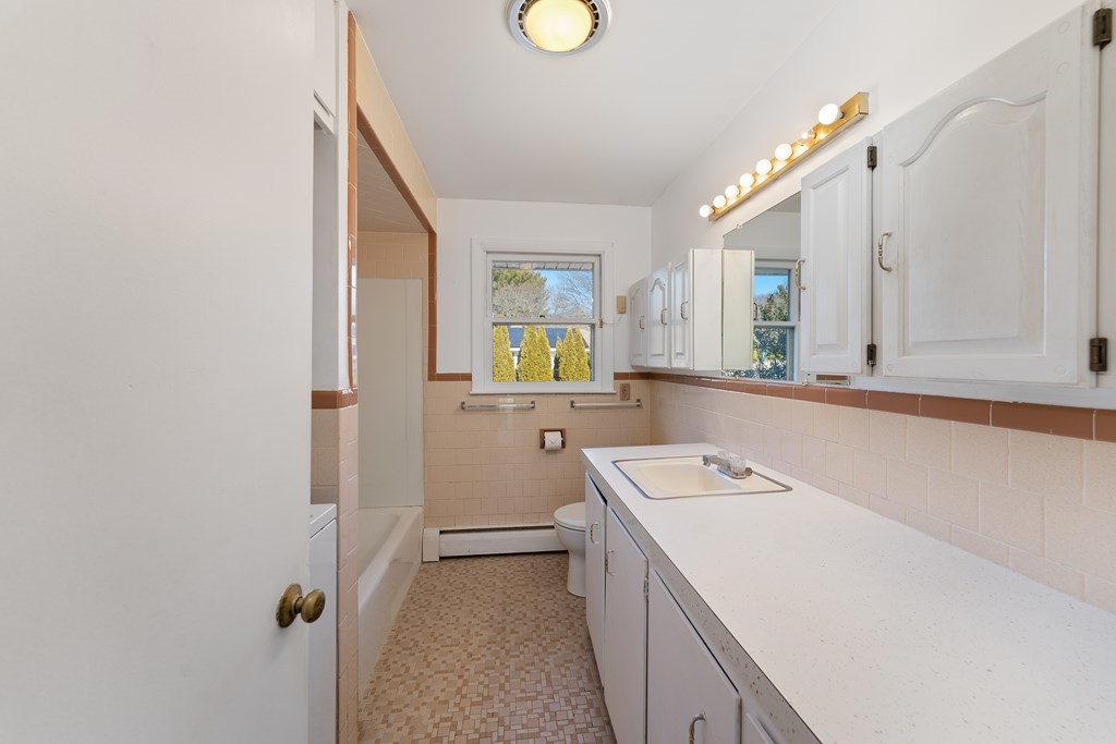 110 Fieldwood Avenue Seekonk, MA 02771 - Photo 21 of 33 a bathroom with a sink a vanity and mirror