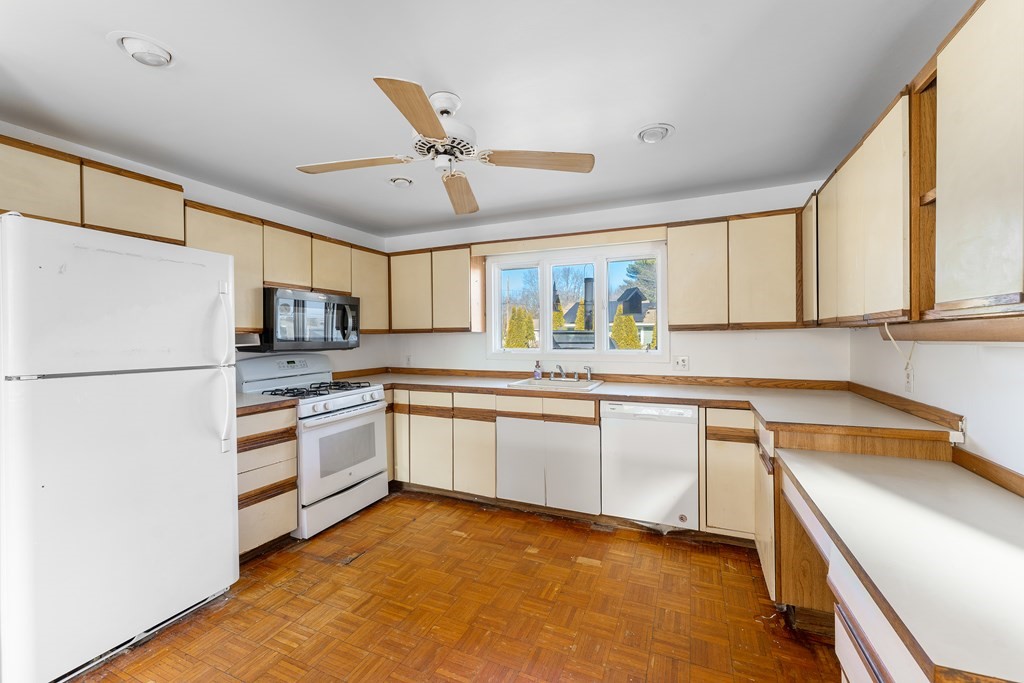110 Fieldwood Avenue Seekonk, MA 02771 - Photo 6 of 33 a kitchen with stainless steel appliances granite countertop a refrigerator sink and stove