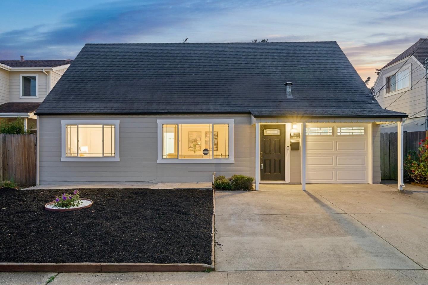 a view of house with backyard