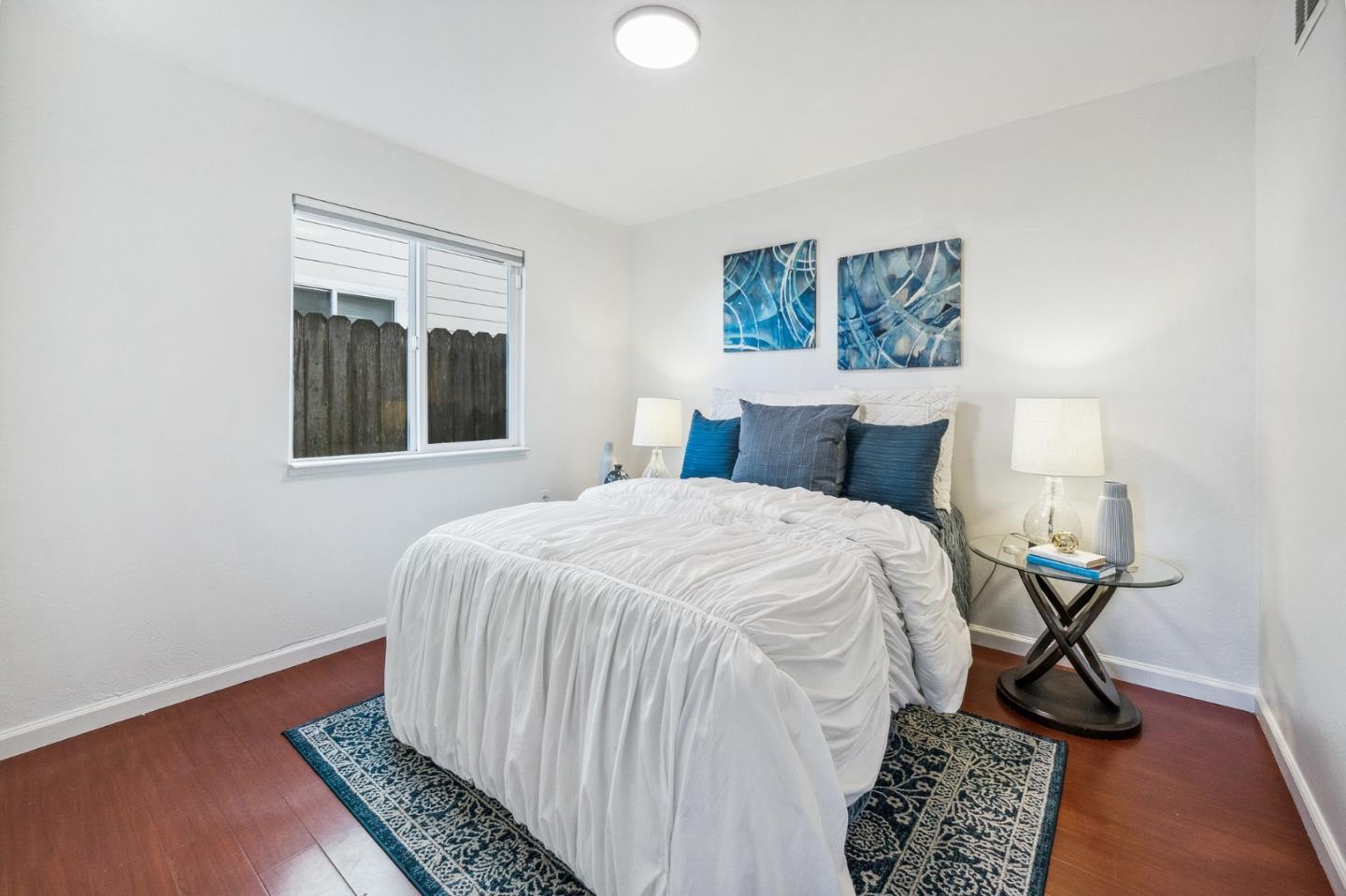 548 Inverness Drive Pacifica, CA 94044 - Photo 13 of 24 a bedroom with a bed and a window