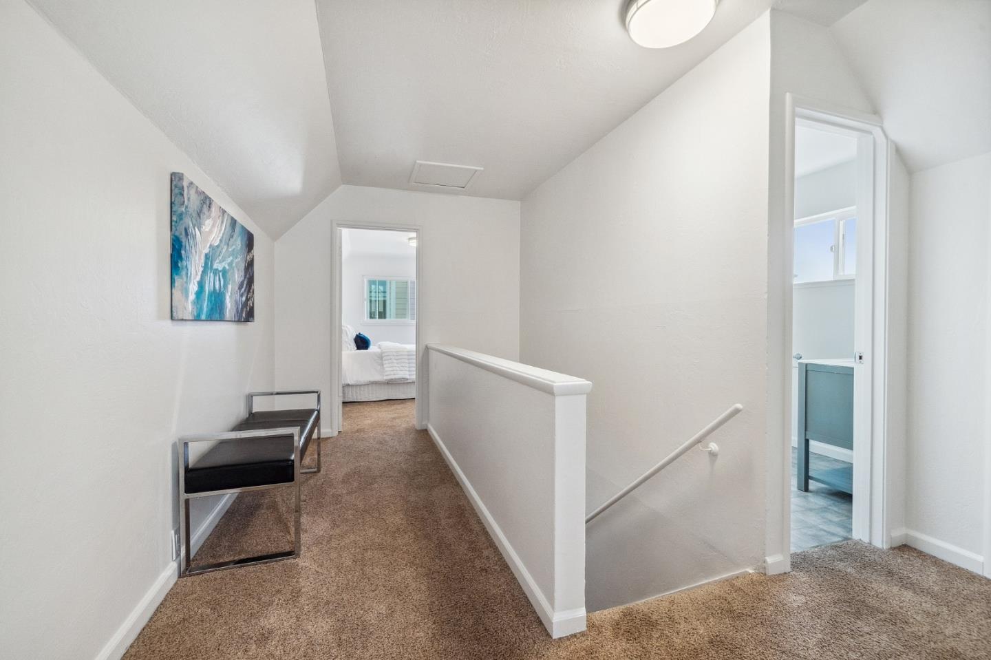 548 Inverness Drive Pacifica, CA 94044 - Photo 14 of 24 a hallway with a white stove and a refrigerator