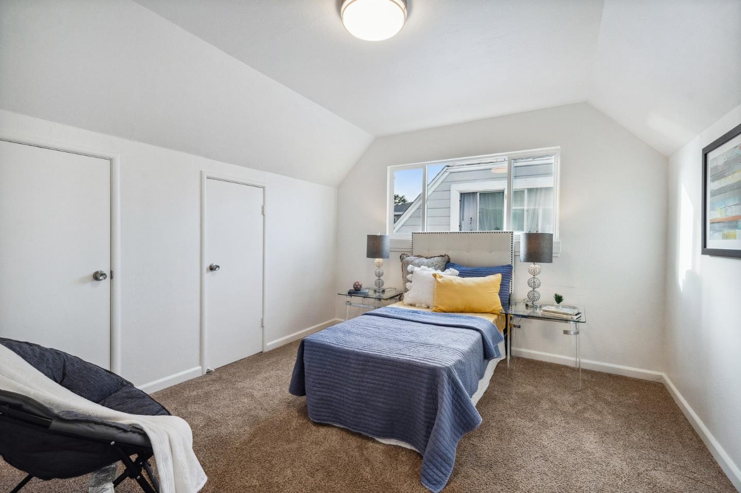 548 Inverness Drive Pacifica, CA 94044 - Photo 15 of 24 a bedroom with a bed and wooden floor
