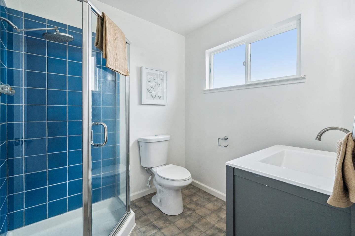 548 Inverness Drive Pacifica, CA 94044 - Photo 16 of 24 a white toilet sitting next to a bathroom sink