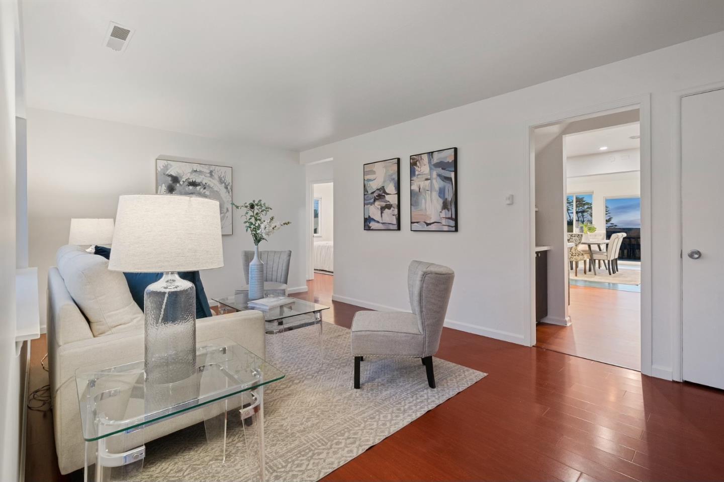 548 Inverness Drive Pacifica, CA 94044 - Photo 21 of 24 a living room with furniture and wooden floor