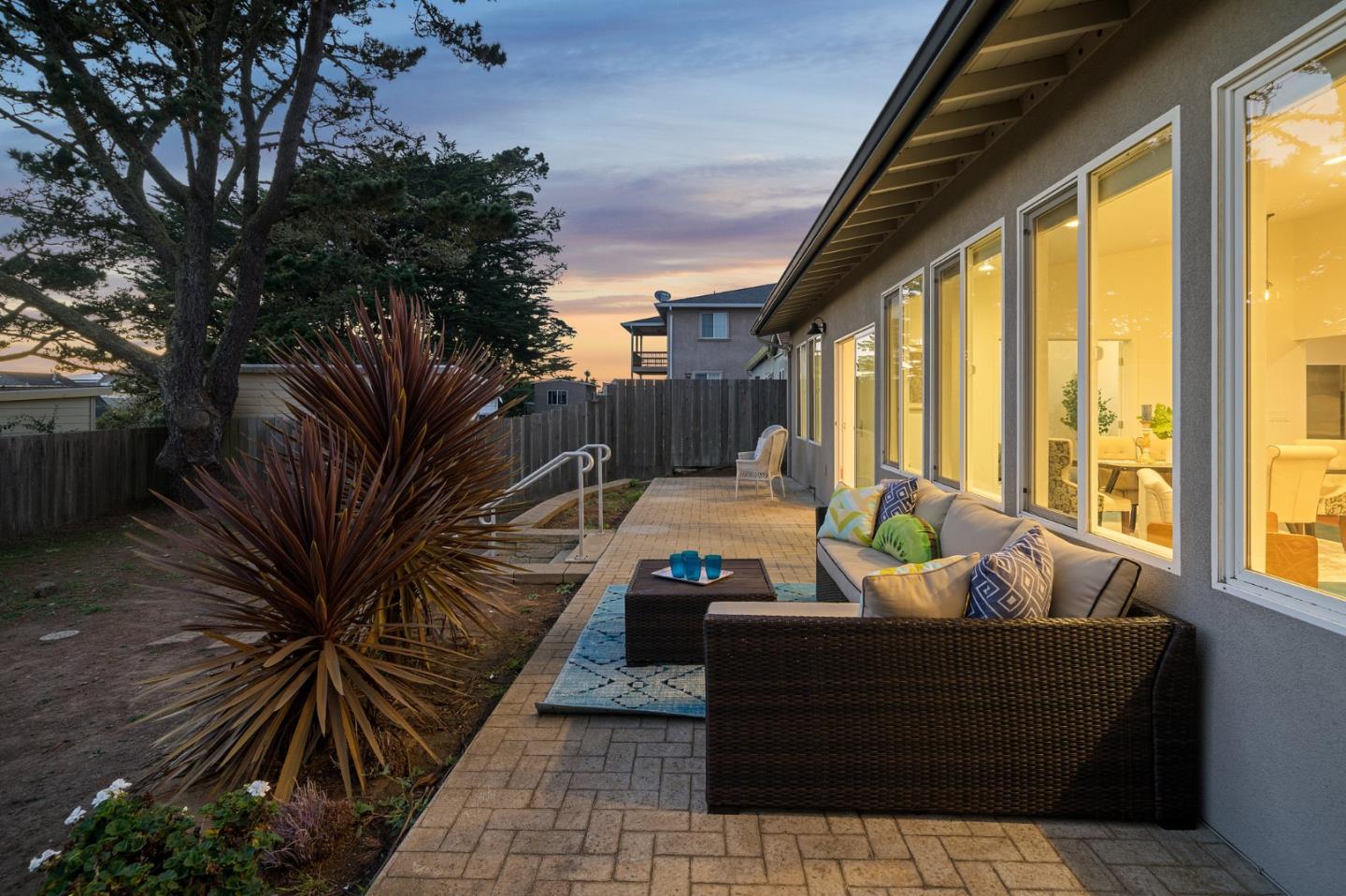 548 Inverness Drive Pacifica, CA 94044 - Photo 23 of 24 a living room with patio furniture and a potted plant