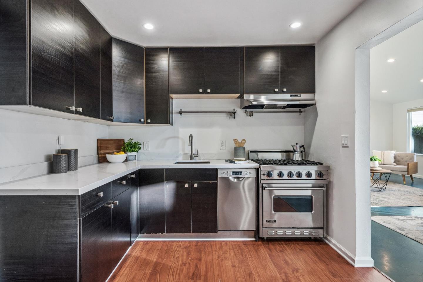 548 Inverness Drive Pacifica, CA 94044 - Photo 5 of 24 a kitchen with stainless steel appliances granite countertop a stove and a sink