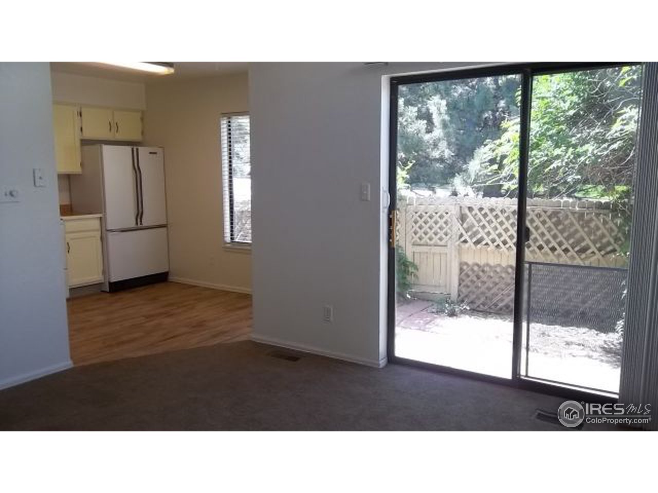 5046 Buckingham Road, Unit 6 Boulder, CO 80301 - Photo 6 of 23 Patio seen through LR sliding doors