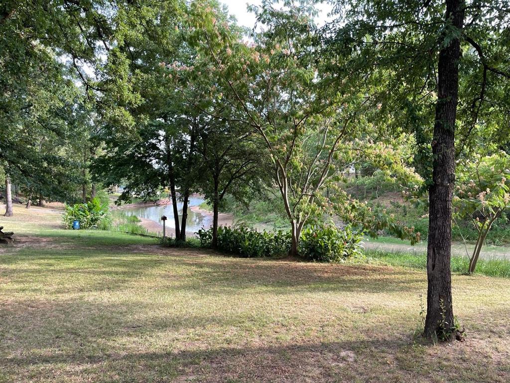 103 Cree Street Mabank, TX 75156 - Photo 3 of 3 a view of a yard with a tree
