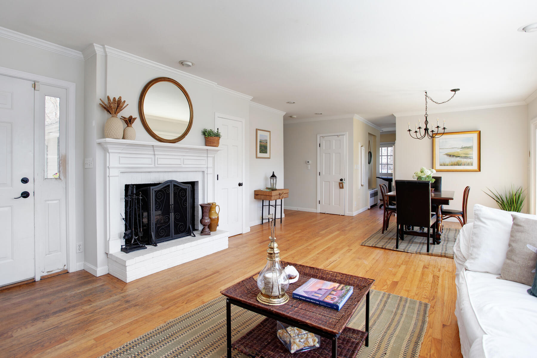 321 Tower Hill Road Osterville, MA 02655 - Photo 15 of 43 a living room with furniture a fireplace a rug and a window
