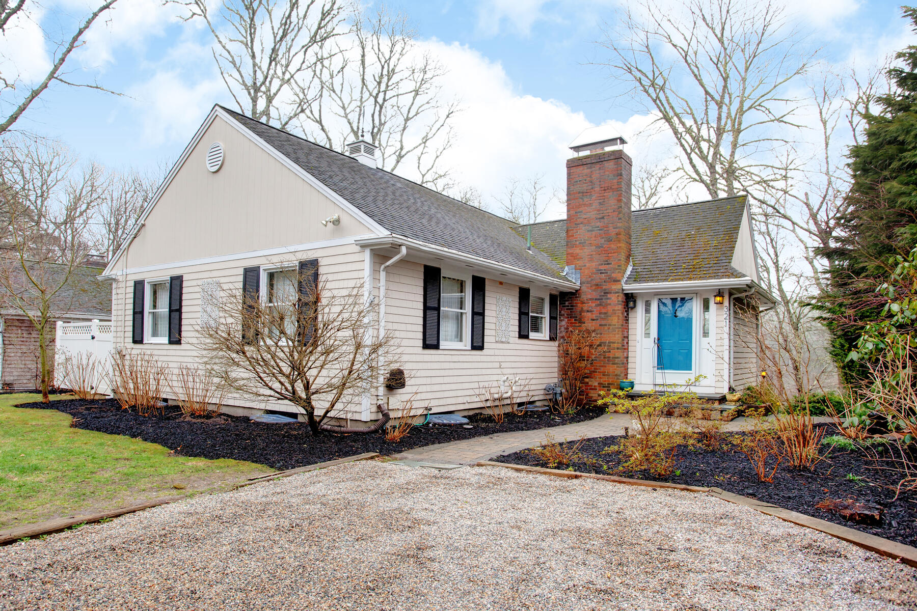 321 Tower Hill Road Osterville, MA 02655 - Photo 2 of 43 a front view of a house with a yard