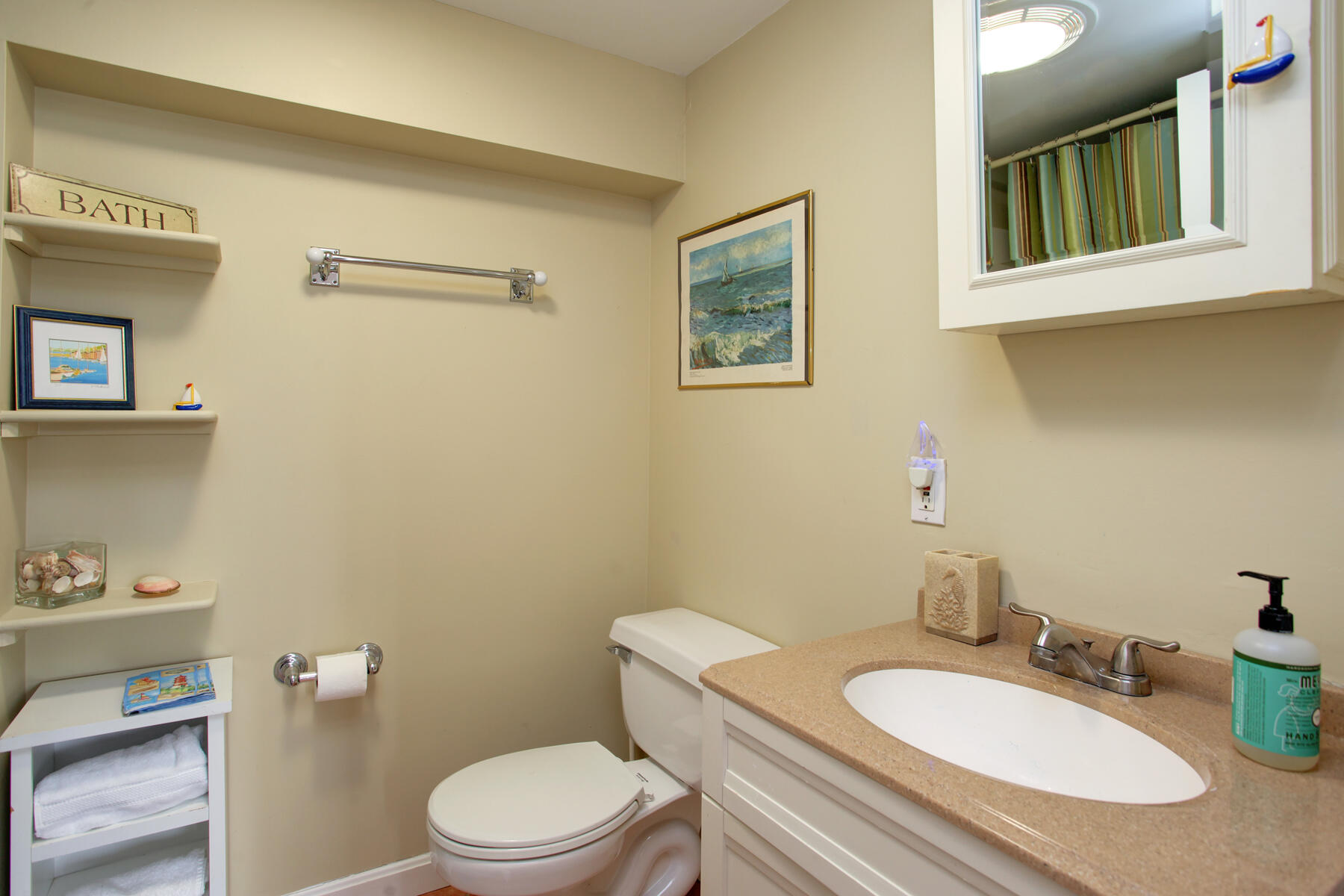 321 Tower Hill Road Osterville, MA 02655 - Photo 41 of 43 a bathroom with a granite countertop toilet sink and mirror