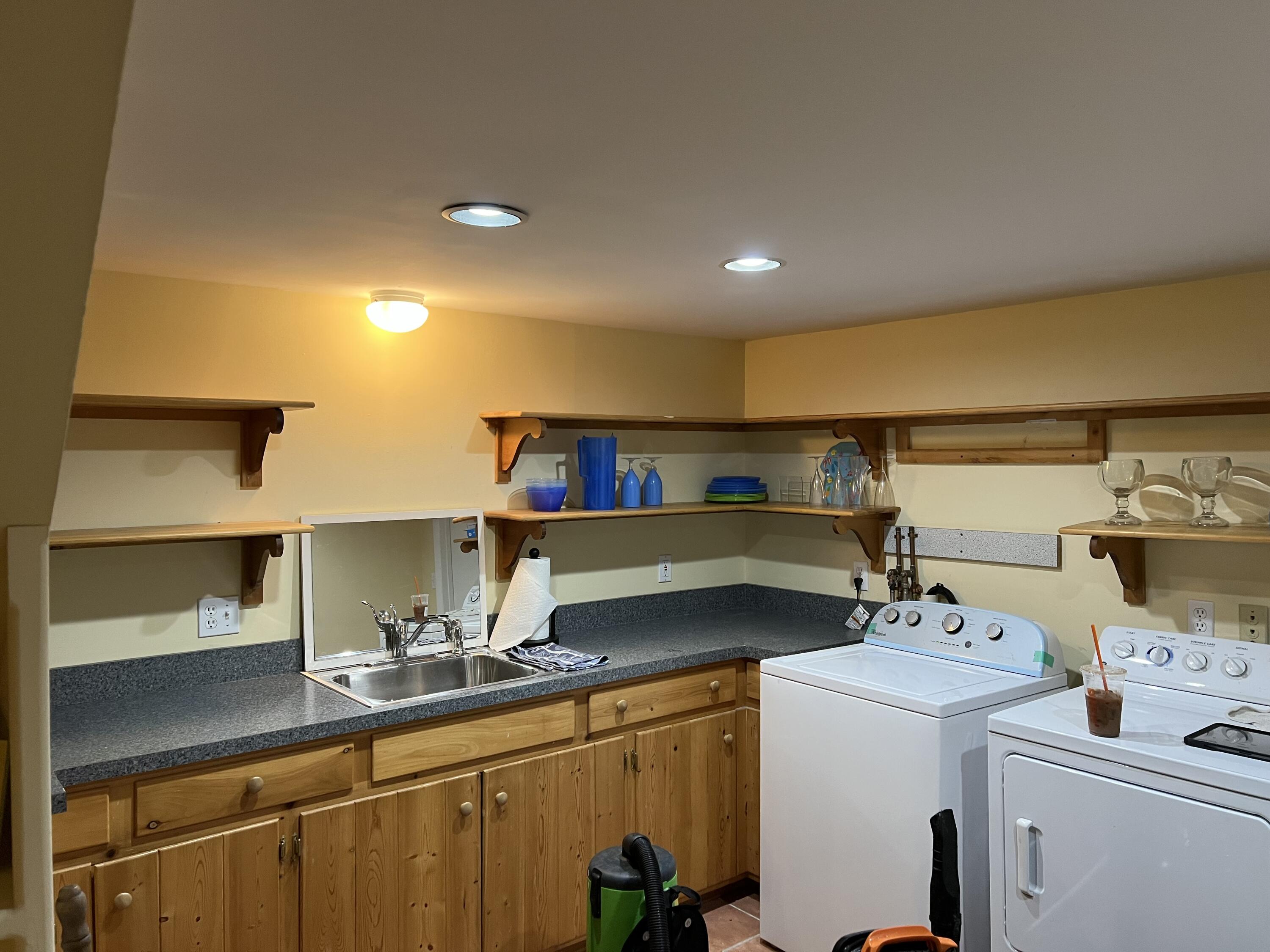 321 Tower Hill Road Osterville, MA 02655 - Photo 42 of 43 a kitchen with a sink and a stove top oven