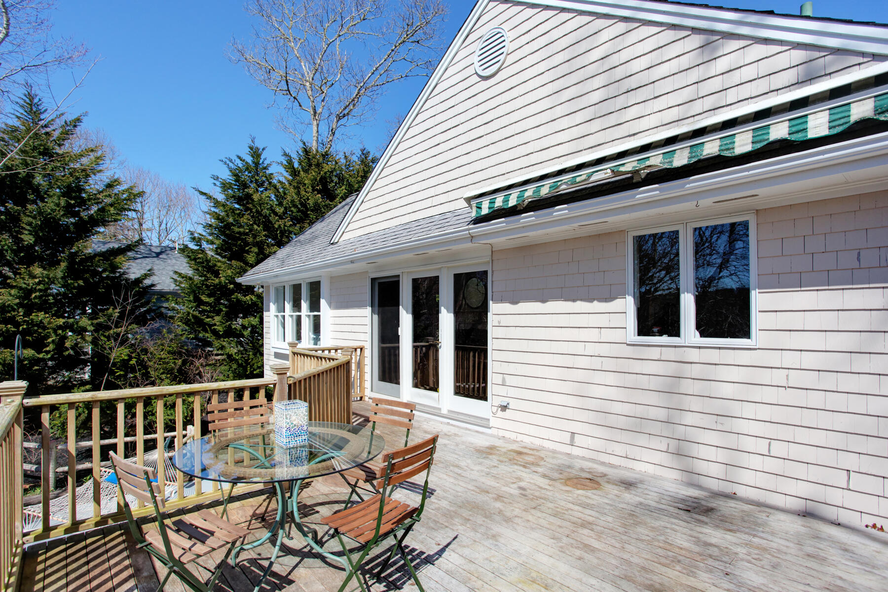 321 Tower Hill Road Osterville, MA 02655 - Photo 9 of 43 a view of a chair and tables in the balcony