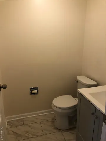 a bathroom with a sink a toilet and bathtub