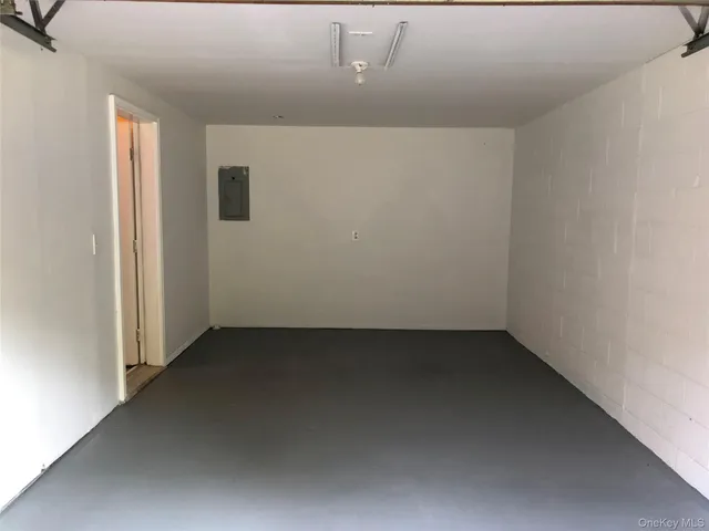 a view of backyard with tub and plants