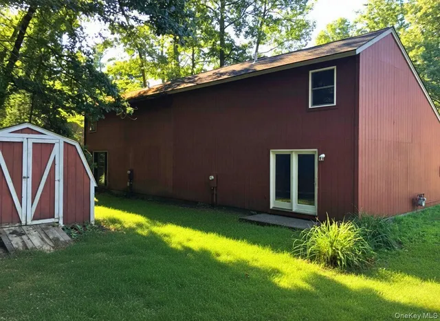 a backyard of a house with lots of green space