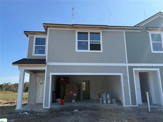 a view of a house with a garage